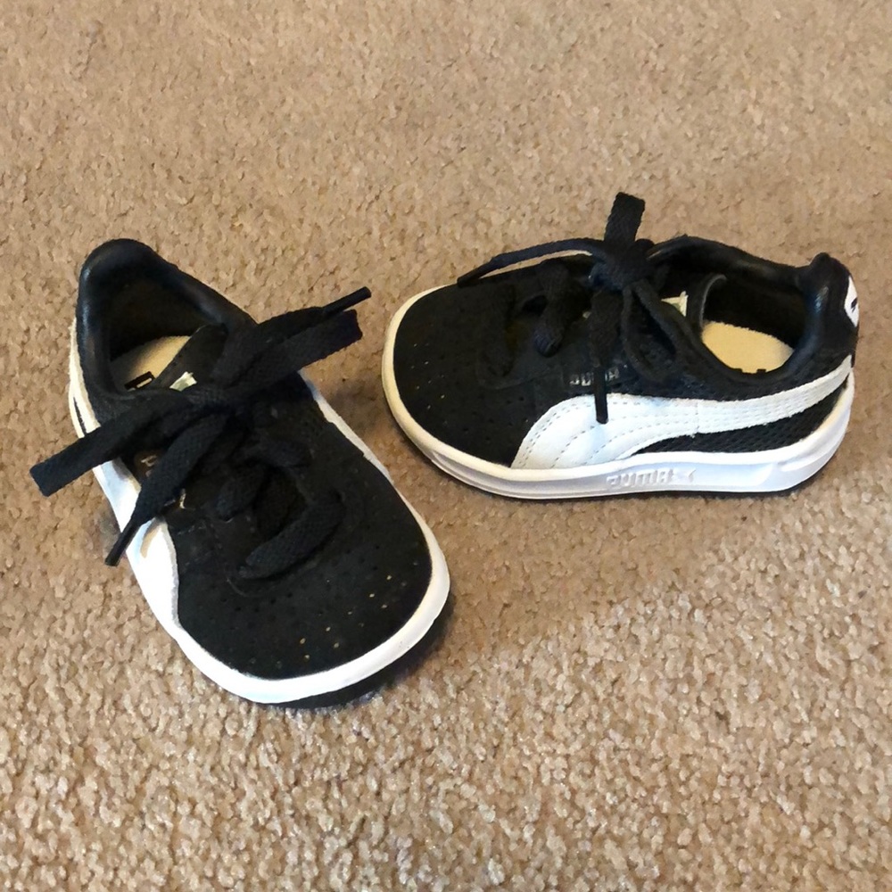 Black and white infant Puma